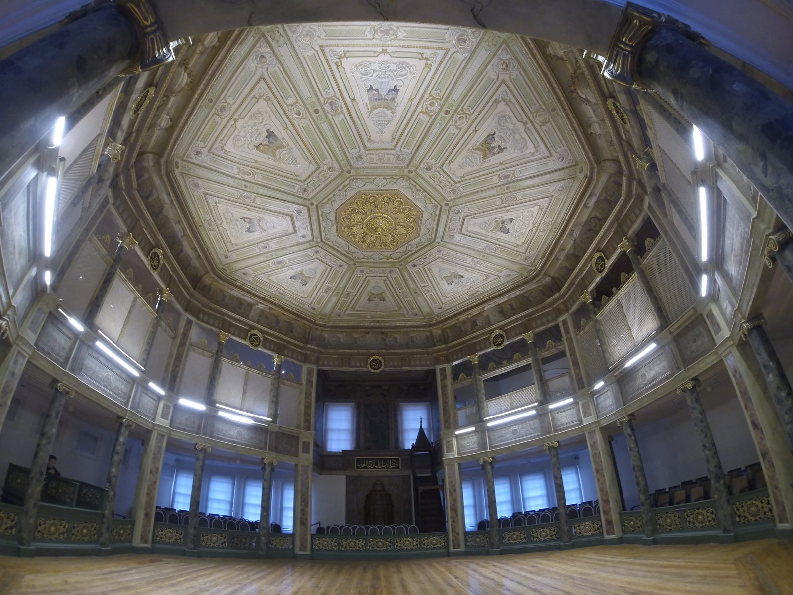 The octagonal semahane interior at Galata Mevlevihanesi, with a wooden gallery and decorated ceiling.