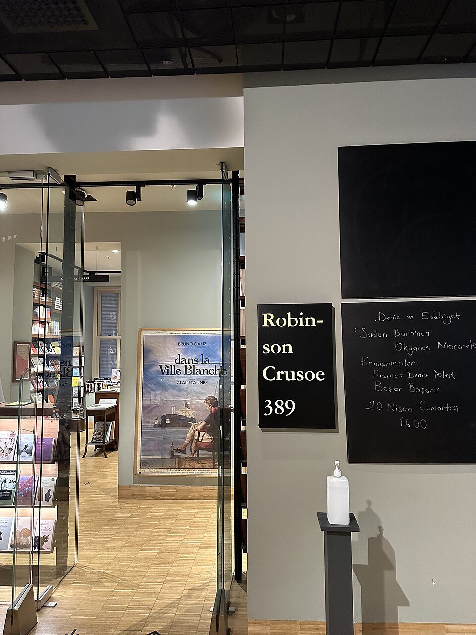 Books and the entrance sign of Robinson Crusoe 389 inside Salt Beyoğlu.