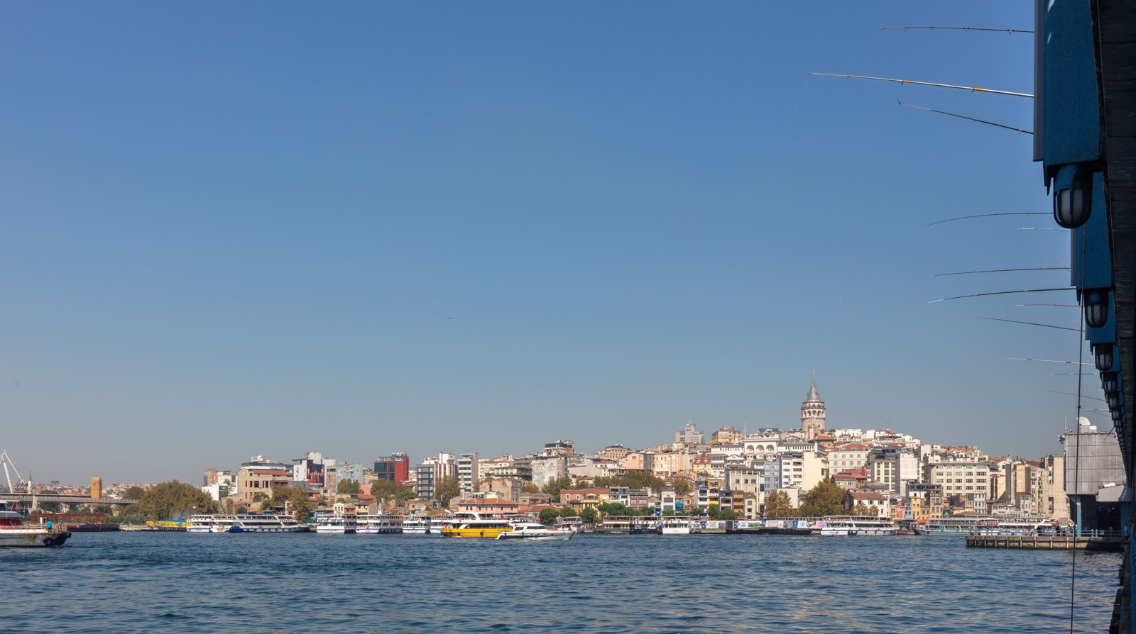 Karaköy from Galata Bridge, with ferries along the shore. September 2024.
