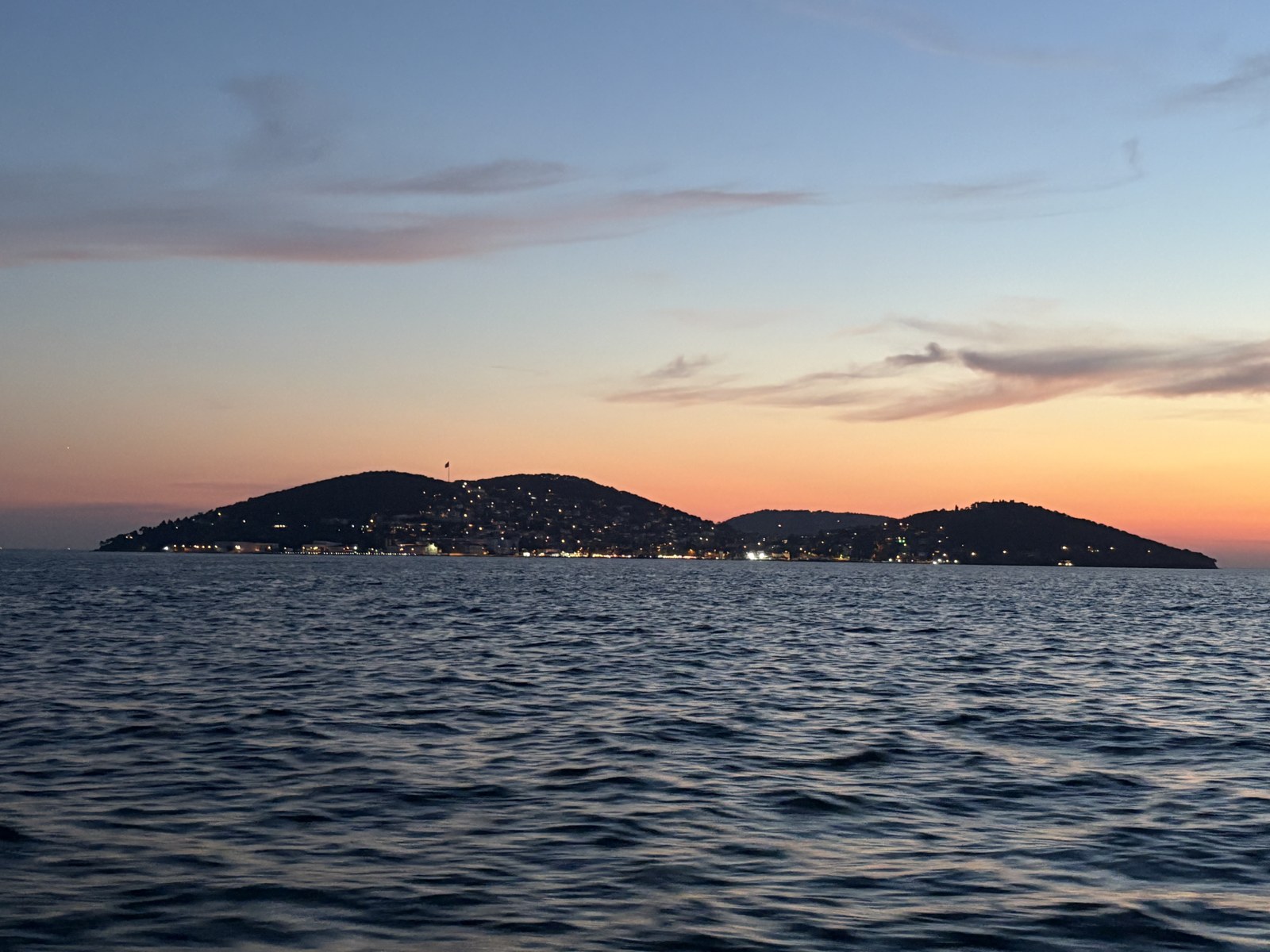 Heybeliada at dusk, seen from the Sea of Marmara in July 2025.